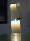 Three lit candles