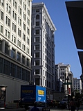 Waxies Truck.  Tall buildings.