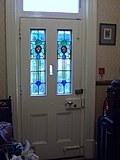 Front door with stained glass leads