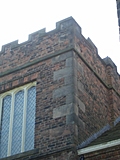 Stone facing work on brick tower