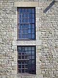Sash windows in stone wall
