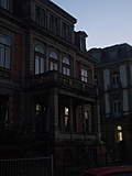 Creepy old building with stone balcony