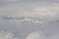 Snow-covered fields seen through clouds 3