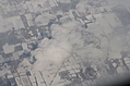 Snow-covered fields seen through clouds 8