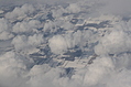 Snow-covered fields seen through clouds 9