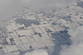 Snow-covered fields seen through clouds 11