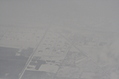 Snow-covered fields seen through clouds 14