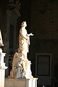 Declaiming lady with weeping angel