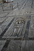 bas-relief gravestone in the floor