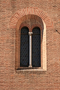 Church of San Giorgio dei Tedeschi 1: Arched window in brick wall