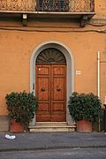Wooden door in arched entrance