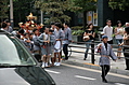 Child with staff leading the mikoshi