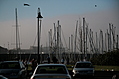 Parked boats, cars and people