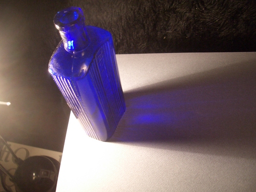[Picture: Antique medicine bottle shown from above]