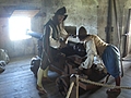 [Picture: Pendennis Castle 44: People loading a cannon]