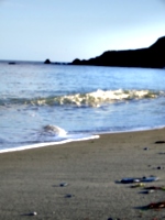 [picture: Wave on calm beach]