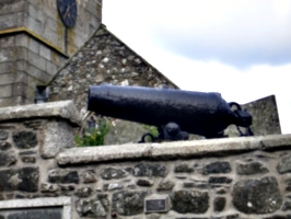 [picture: Cannon on stone wall]
