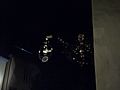 [Picture: Shop sign in the dark]