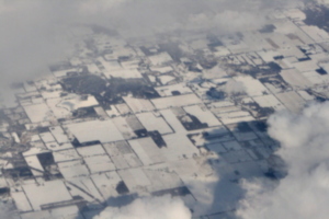 [picture: Snow-covered fields seen through clouds 11]