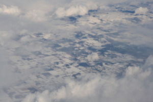 [picture: Snow-covered fields seen through clouds 12]
