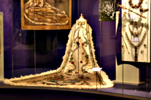 [picture: Old Mardi Gras Costume with flowing train]