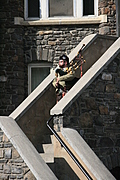[Picture: Lone bagpiper on the castle walls.]