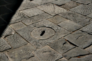 [picture: Stone man-hole cover]