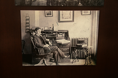 [Picture: Writer at his desk]