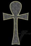 [Picture: Granite ankh cross with gold trim and a perspective shadow, on a black background]