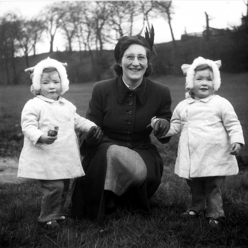 [Picture: Mother with Twins]