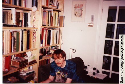 [Picture: Liam using a laptop computer in 1998 or 1999, with a cat (Moon) helping.]