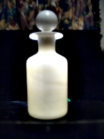 [picture: Antique white glass bottle]