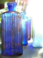 [picture: Blue antique medicine bottle with strong light]