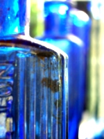 [picture: Blue antique medicine bottle with strong light 2]