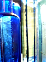 [picture: Blue antique medicine bottle with strong light 3]