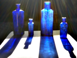 [picture: Four medicine bottles with sunlight streaming past]