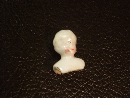 [Picture: Old china doll’s head 4]