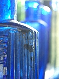 [Picture: Blue antique medicine bottle with strong light 2]