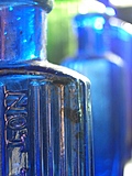 [Picture: Blue antique medicine bottle with strong light 3]