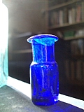 [Picture: Tiny blue glass bottle]