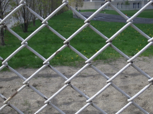 [Picture: chain-link fence outside school 2]