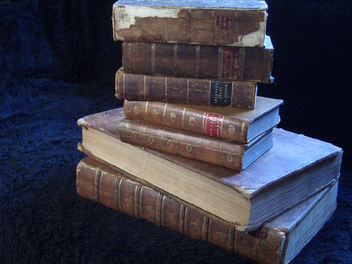 [Picture: Another pile of old books]
