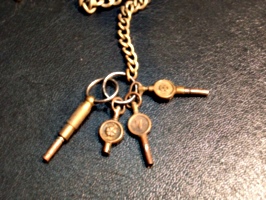 [Picture: Antique watch keys]