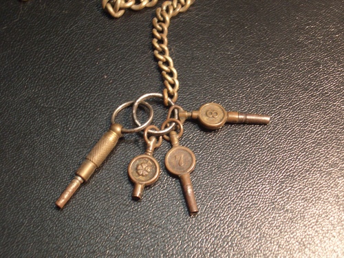 [Picture: Antique watch keys]