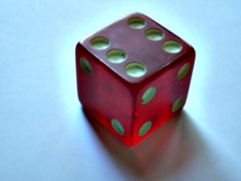 [picture: A red glass (or resin) dice]