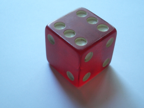 [Picture: A red glass (or resin) dice]