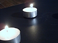 [Picture: Two Tea lights]