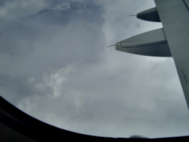 [picture: Clouds through the porthole]