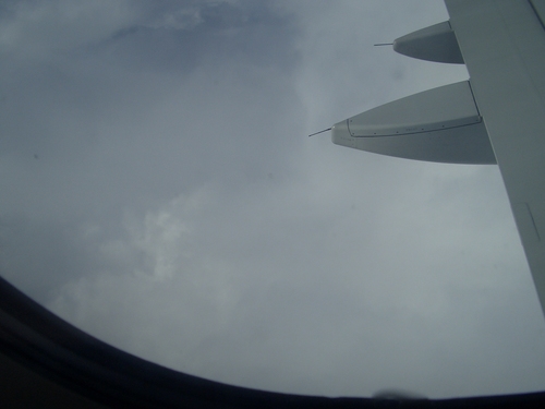 [Picture: Clouds through the porthole]