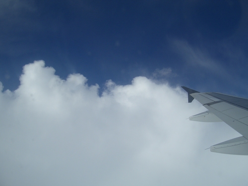 [Picture: Clouds, blue sky, wing]